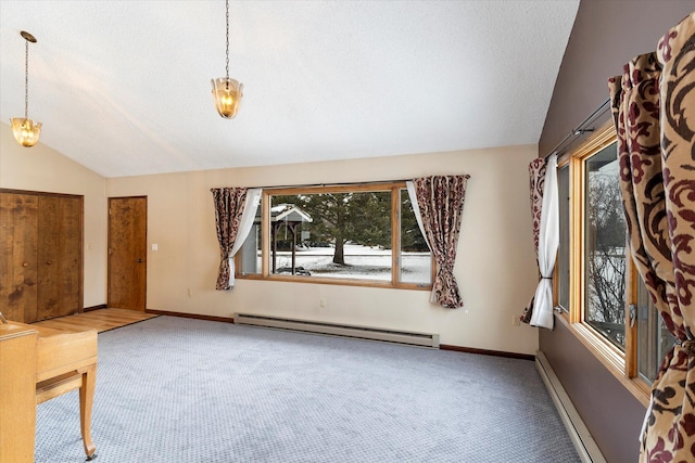 unfurnished living room with carpet flooring, vaulted ceiling, and baseboard heating