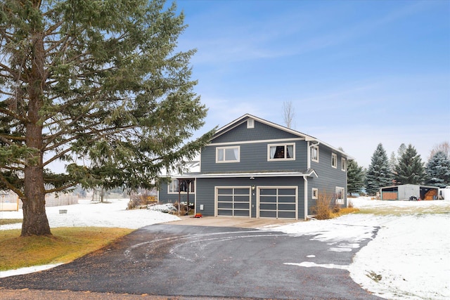 50 Stonecrest Dr, Kalispell, MT 59901 - view of front of property featuring asphalt driveway and an attached garage