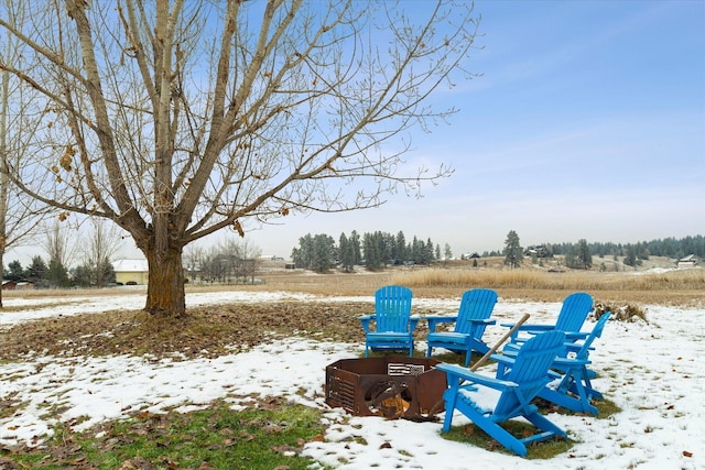 view of yard layered in snow