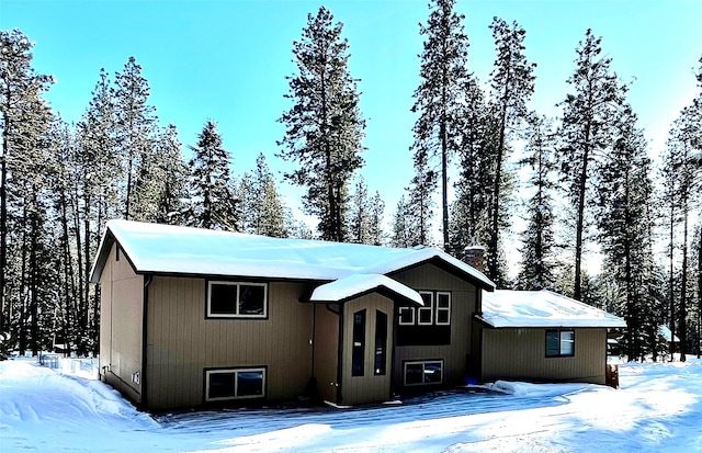 view of snow covered house