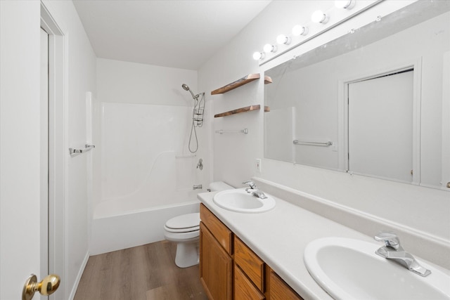 1888 N Belmar Dr, Kalispell, MT 59901 - bathroom featuring wood finished floors, double vanity, and bathtub / shower combination