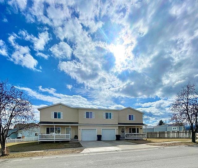 1888 N Belmar Dr, Kalispell, MT 59901 - view of front of home featuring a porch, concrete driveway, and a garage