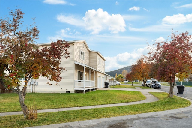 1888 N Belmar Dr, Kalispell, MT 59901 - view of side of property featuring a lawn and an attached garage