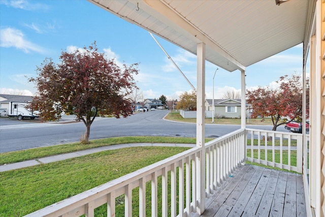 wooden terrace featuring covered porch