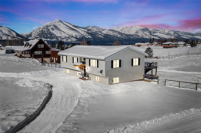 view of front of property featuring a garage and a mountain view