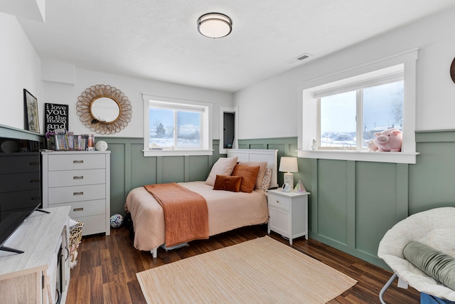 bedroom featuring dark wood-type flooring