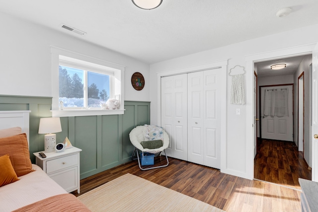 bedroom featuring a closet and dark hardwood / wood-style floors