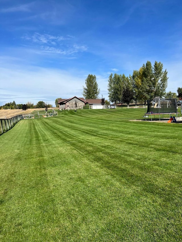 view of yard with a trampoline