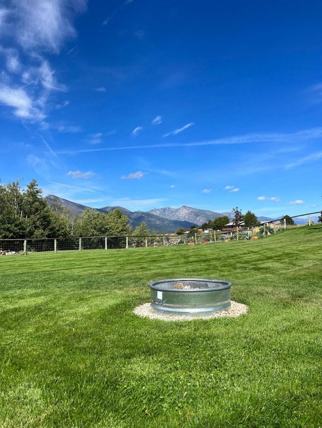 view of yard featuring a mountain view and a rural view