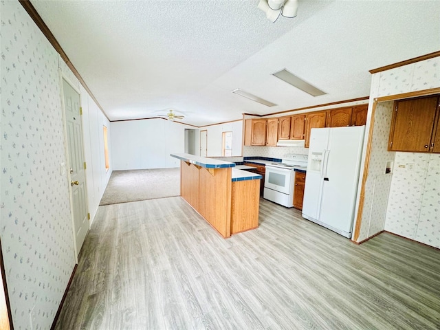 kitchen with a kitchen bar, crown molding, light wood-type flooring, a kitchen island, and white appliances