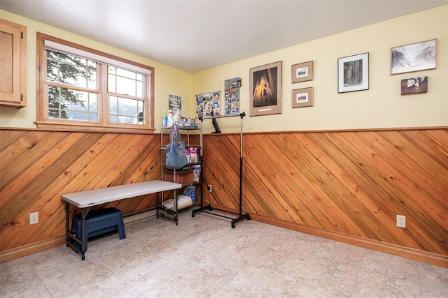 miscellaneous room with wood walls