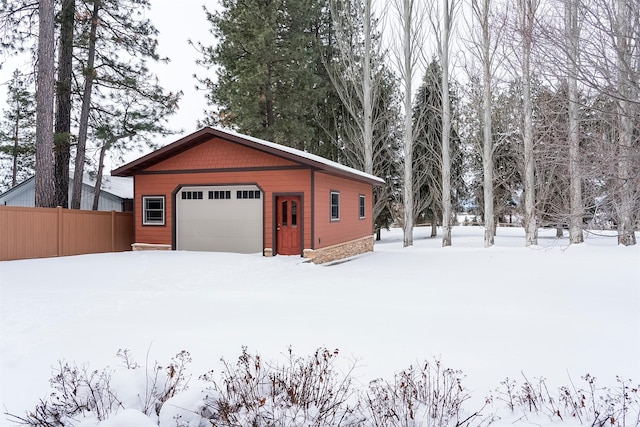 view of snow covered garage