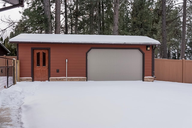 view of snow covered garage