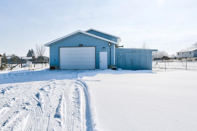 view of snow covered garage