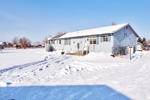 view of snow covered house