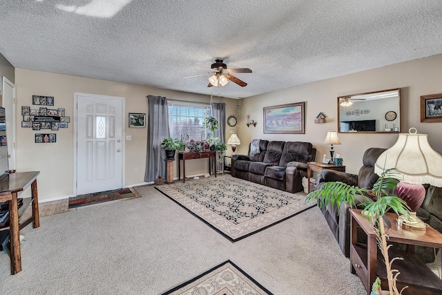 living room featuring carpet flooring, a textured ceiling, and ceiling fan