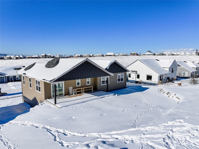 7018 Max Dr, Missoula, MT 59803 - snow covered back of property with board and batten siding