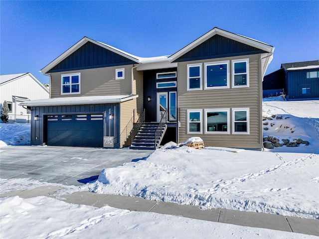 7018 Max Dr, Missoula, MT 59803 - raised ranch featuring board and batten siding, driveway, and a garage