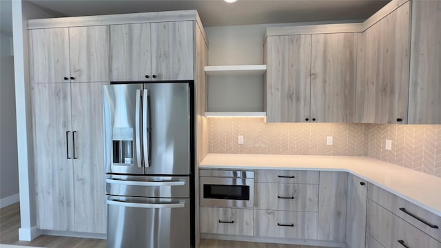 7018 Max Dr, Missoula, MT 59803 - kitchen with stainless steel appliances, backsplash, modern cabinets, open shelves, and light countertops