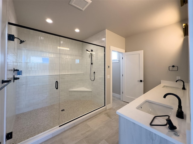 bathroom featuring vanity and an enclosed shower