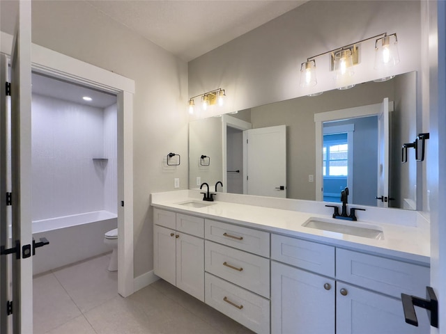 full bathroom with tile patterned flooring, vanity, bathing tub / shower combination, and toilet