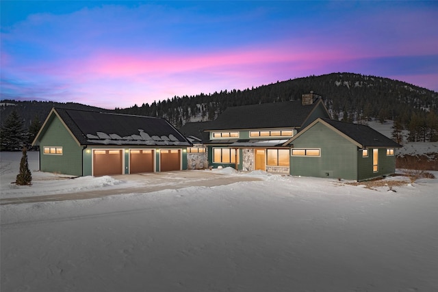 modern farmhouse style home featuring a mountain view