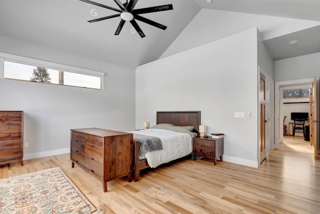 bedroom featuring light hardwood / wood-style flooring, high vaulted ceiling, and ceiling fan