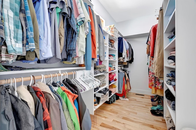 spacious closet featuring light hardwood / wood-style floors