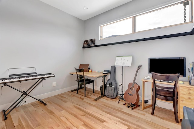 office space with light wood-type flooring