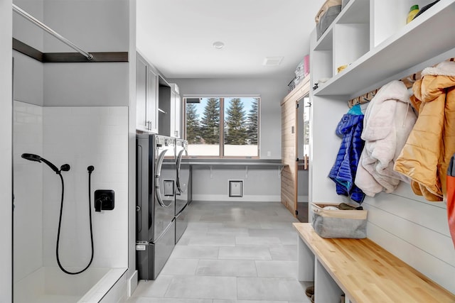 mudroom with washing machine and dryer