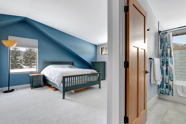 carpeted bedroom featuring vaulted ceiling