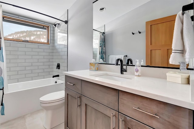 full bathroom with vanity, toilet, tiled shower / bath combo, and tile patterned flooring