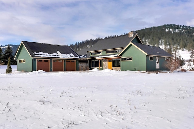 view of front of property with a mountain view