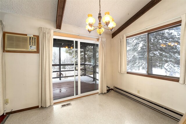 empty room featuring visible vents, a wall unit AC, a textured ceiling, and baseboard heating