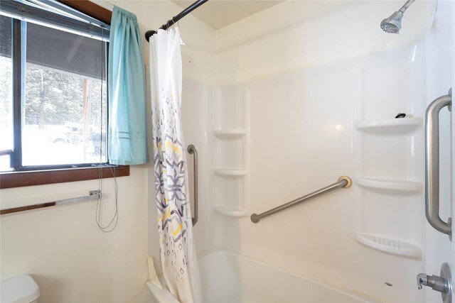 full bathroom with shower / bath combo with shower curtain