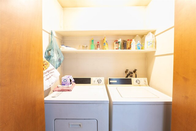 laundry area with laundry area and washer and clothes dryer