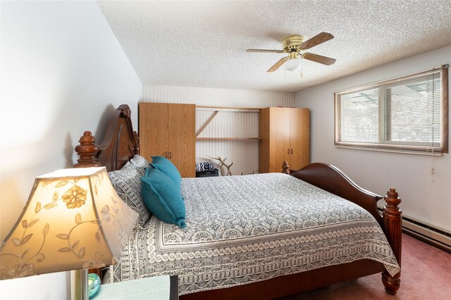 carpeted bedroom with a ceiling fan and a textured ceiling