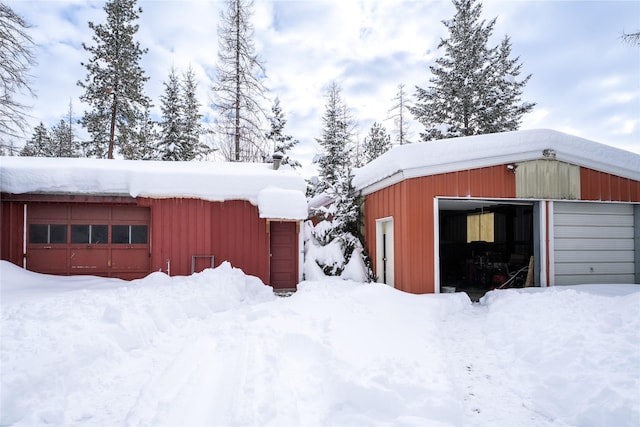 snow covered structure featuring an outdoor structure