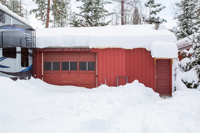 view of snow covered garage