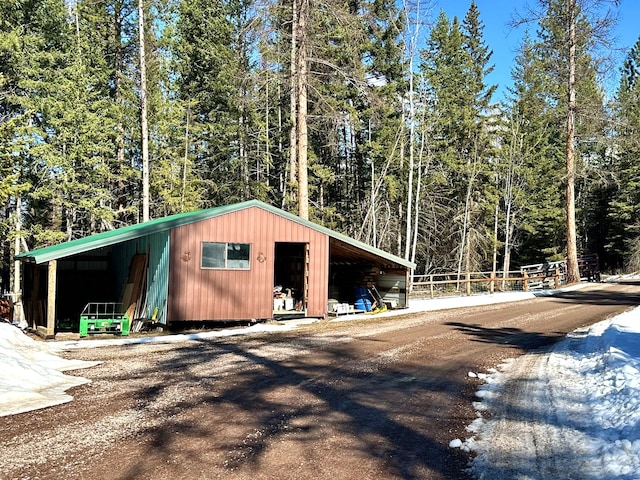 view of outdoor structure featuring a view of trees