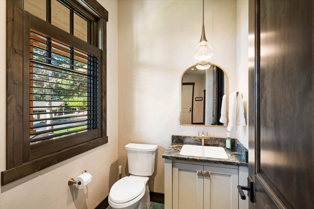 113 Levi Ct, Bigfork, MT 59911 - half bath featuring vanity and toilet