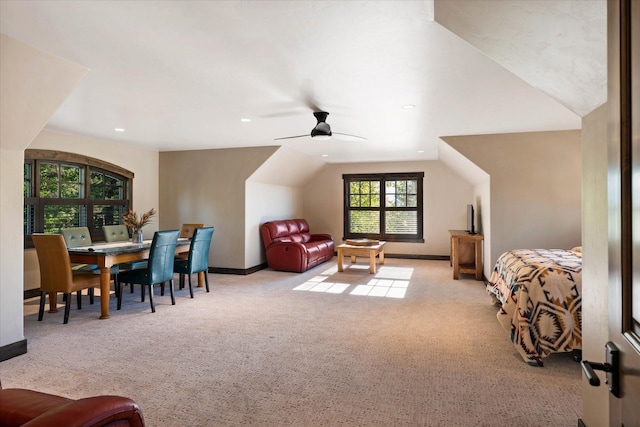 interior space featuring lofted ceiling and light colored carpet