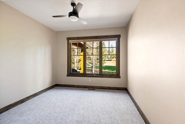 unfurnished room with ceiling fan