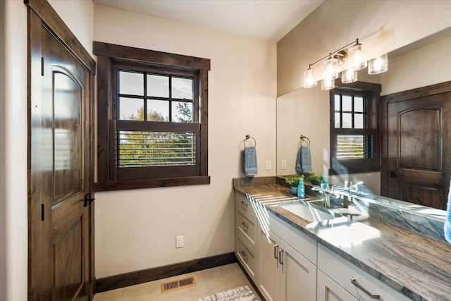 113 Levi Ct, Bigfork, MT 59911 - bathroom featuring vanity and tile patterned flooring