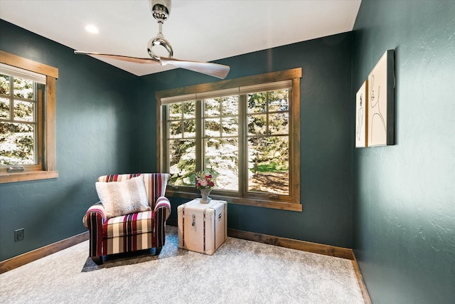 113 Levi Ct, Bigfork, MT 59911 - sitting room featuring carpet flooring, ceiling fan, and healthy amount of natural light