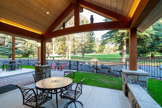 113 Levi Ct, Bigfork, MT 59911 - fenced backyard with outdoor dining space and a patio area