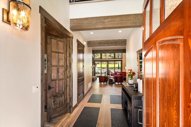 113 Levi Ct, Bigfork, MT 59911 - foyer featuring beamed ceiling, wood finished floors, and recessed lighting
