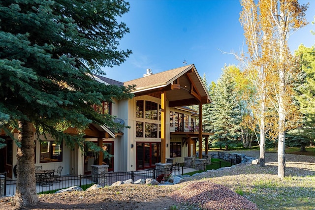 113 Levi Ct, Bigfork, MT 59911 - view of front facade featuring a patio and a balcony