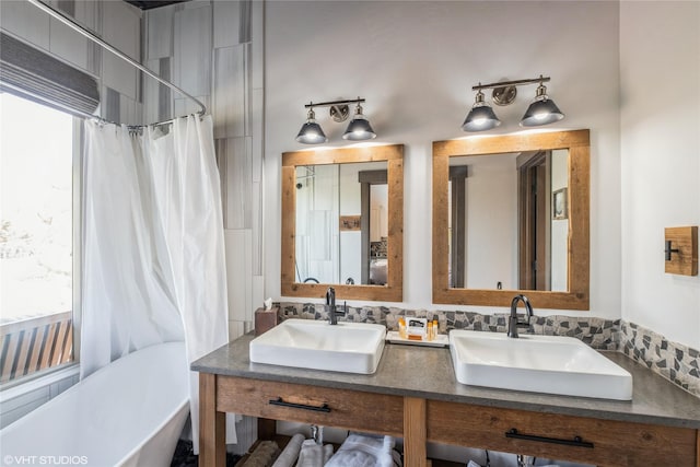 76 Rusty Iron Way, Eureka, MT 59917 - bathroom featuring a freestanding bath, a shower with curtain, and double vanity