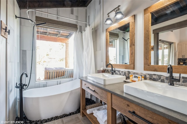 76 Rusty Iron Way, Eureka, MT 59917 - full bath featuring a soaking tub, double vanity, and a shower with curtain